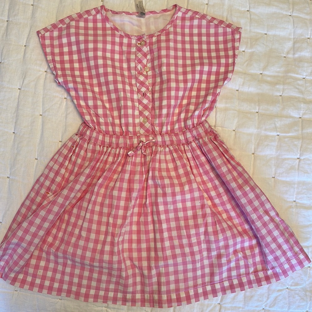 Primary, Size 8-9. Perfect for spring. Two small stains on the bottom of dress.